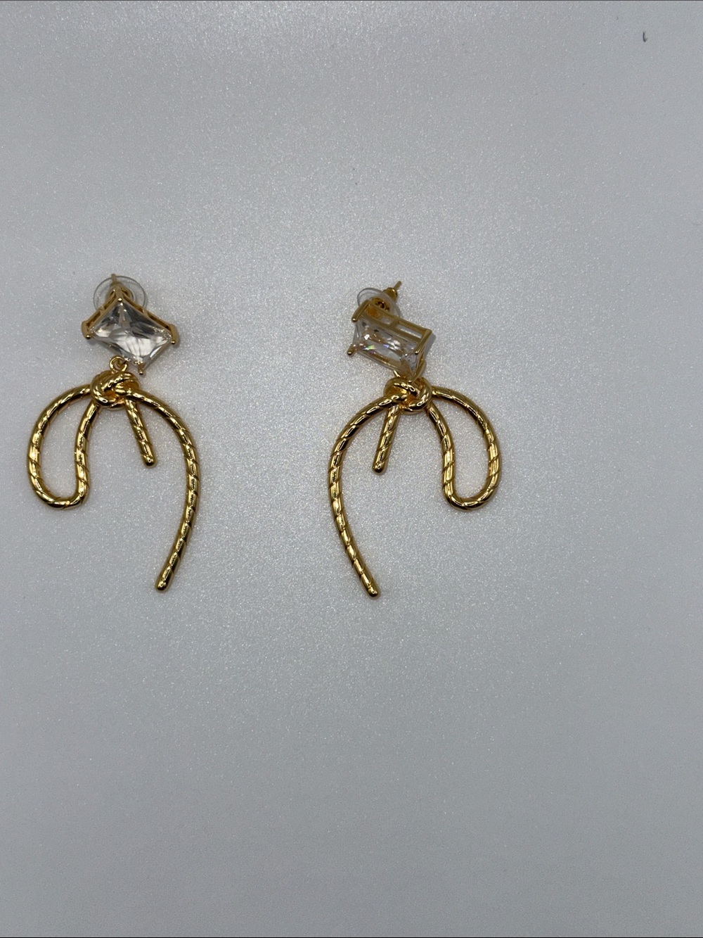 Gold Bow Drop Earrings with Clear Stone Accent